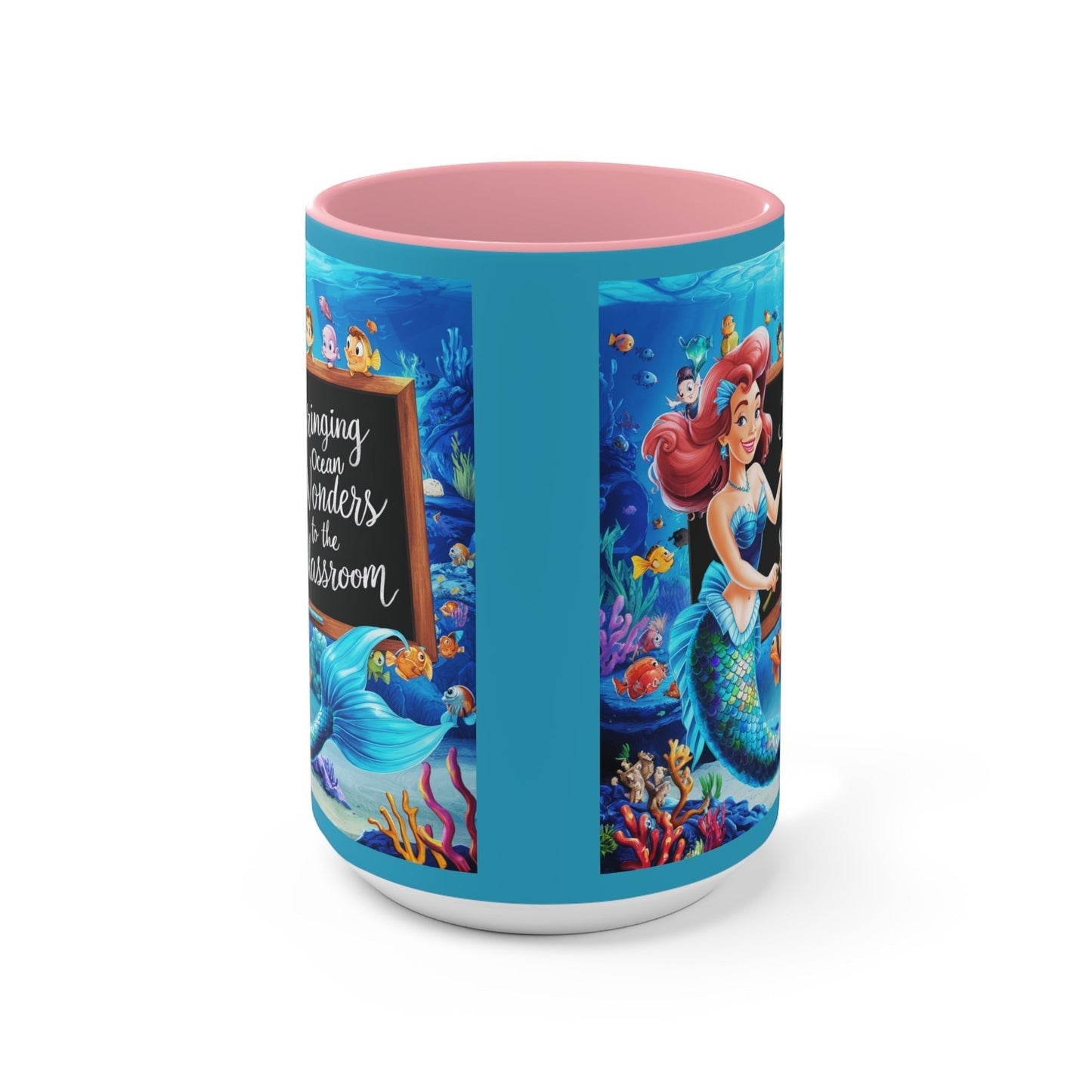 Ocean-themed accent mug with blue sides and pink interior, showing mermaid and ocean scene