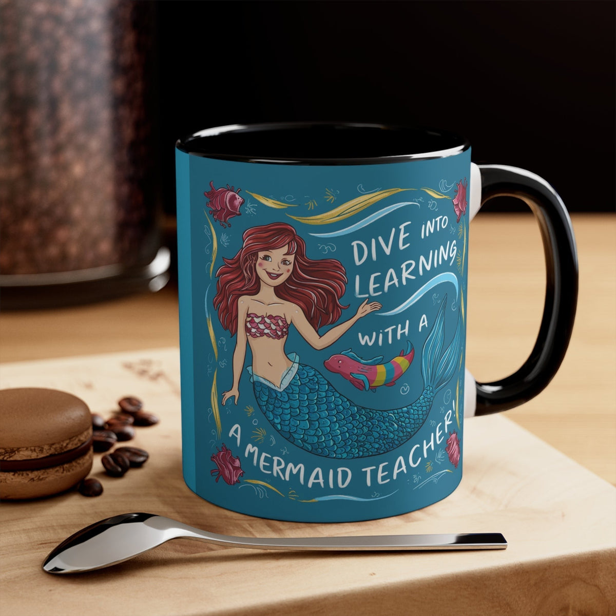 Black accent mug with teal mermaid graphic and "Dive into Learning" text