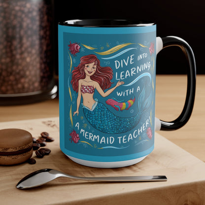 Black ceramic mug with mermaid teacher graphic, 'Dive into learning' and mermaid illustration