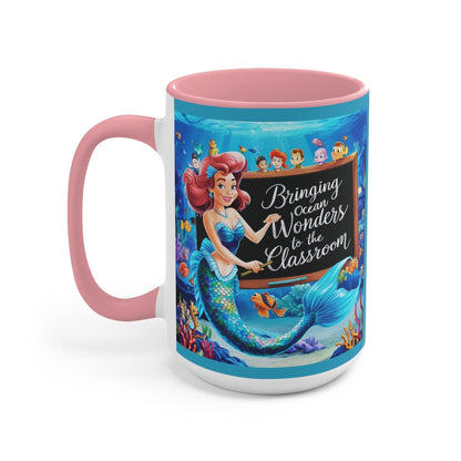 Pink ceramic accent mug with mermaid and ocean friends graphic, front view, pink handle.