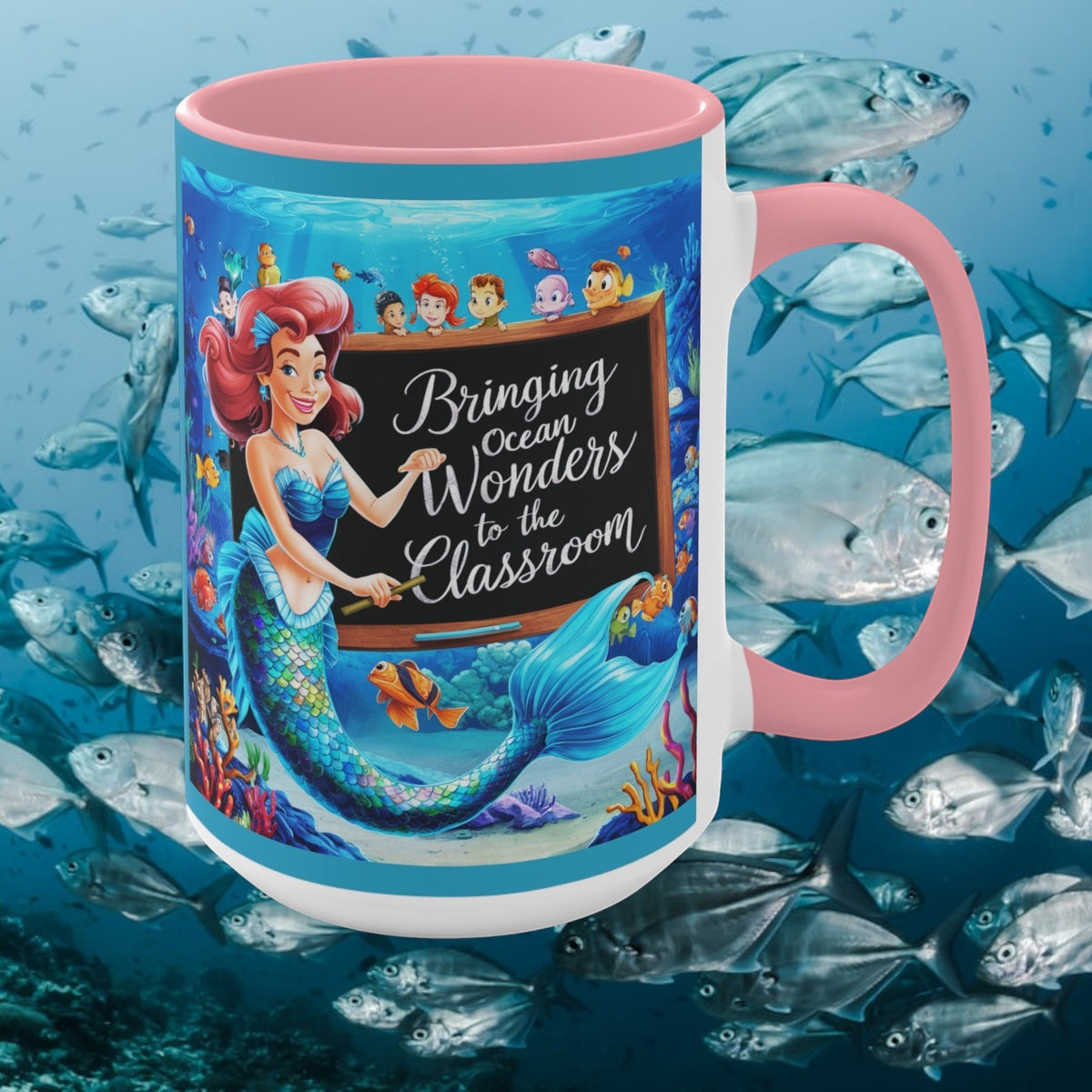 Pink ceramic accent mug with ocean mermaid and kids graphic, pink handle and rim
