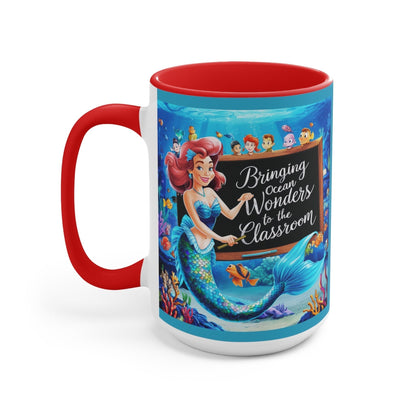 Red ceramic accent mug with mermaid and ocean friends graphic, front view with red handle.