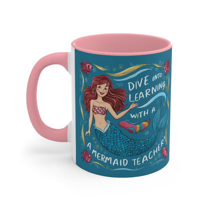 Pink ceramic mug with mermaid teacher graphic and ocean-themed 'Dive into learning' text
