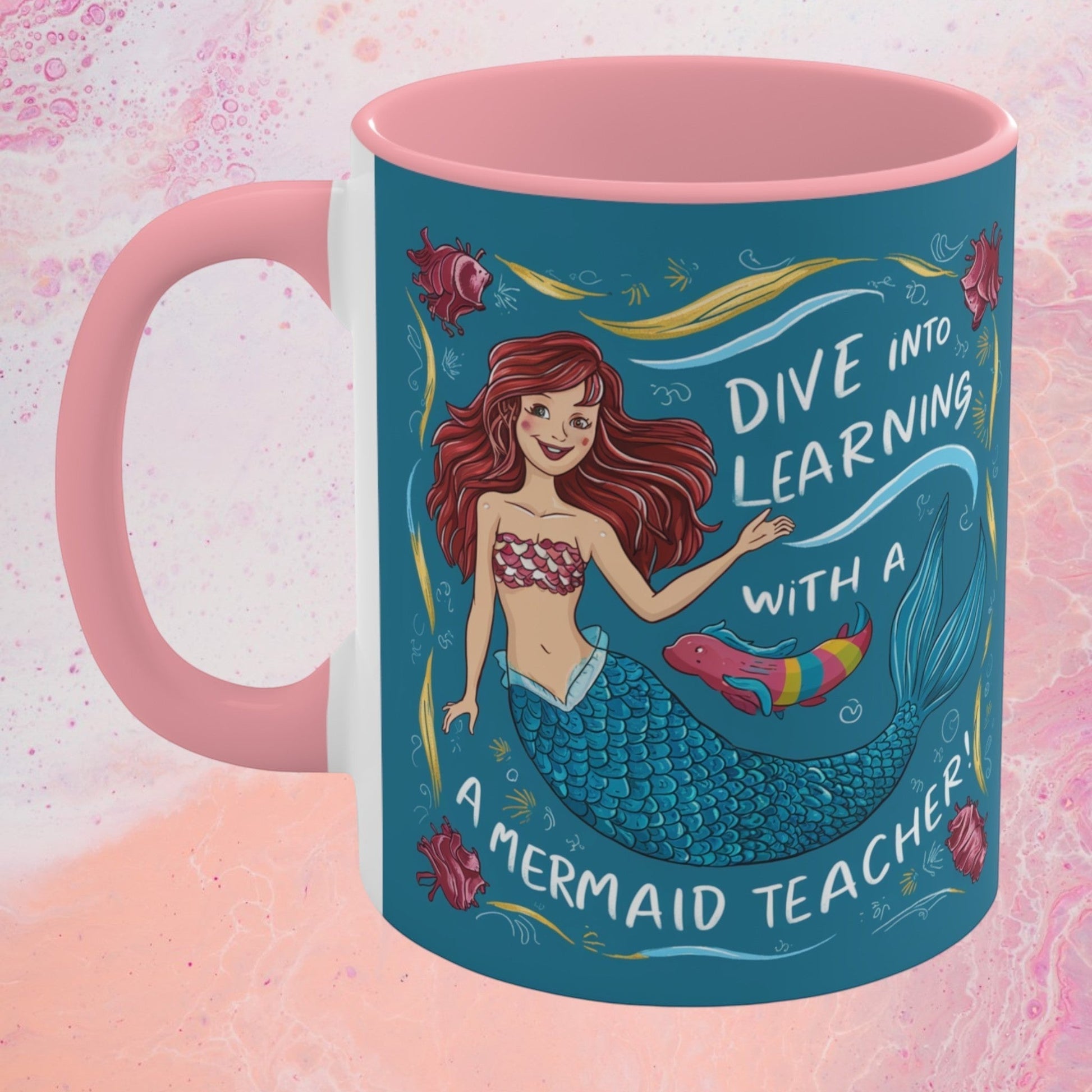 Pink accent mug with teal mermaid graphic and "Dive into Learning" text