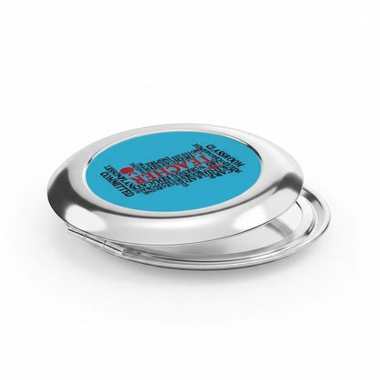 Compact travel mirror, closed silver glossy case with blue word-collage center