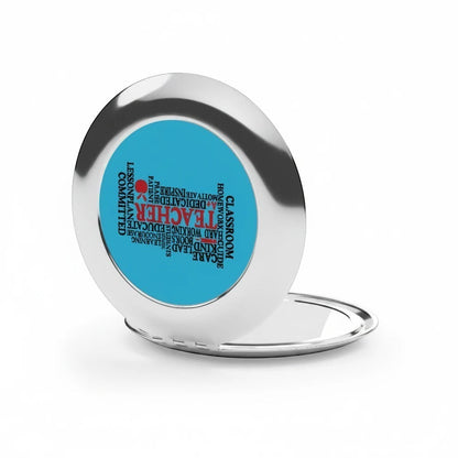 Compact travel mirror, open silver frame with blue word-collage insert