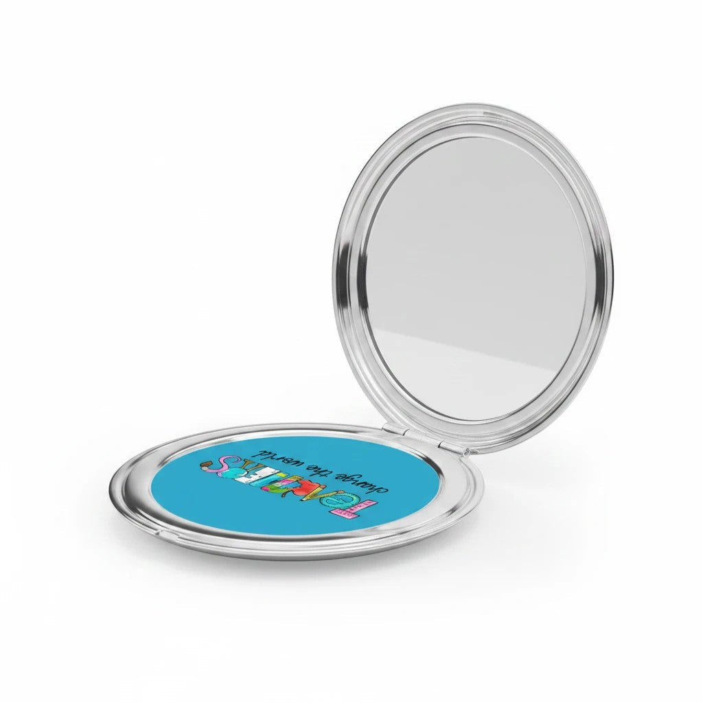 Silver glossy compact travel mirror open, showing blue Teachers graphic on the lower panel