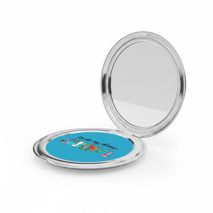 Silver glossy compact travel mirror open, showing blue Teachers graphic on the lower panel