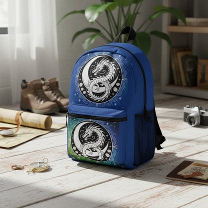 Blue dragon yin-yang backpack with two circular graphic panels and black shoulder straps