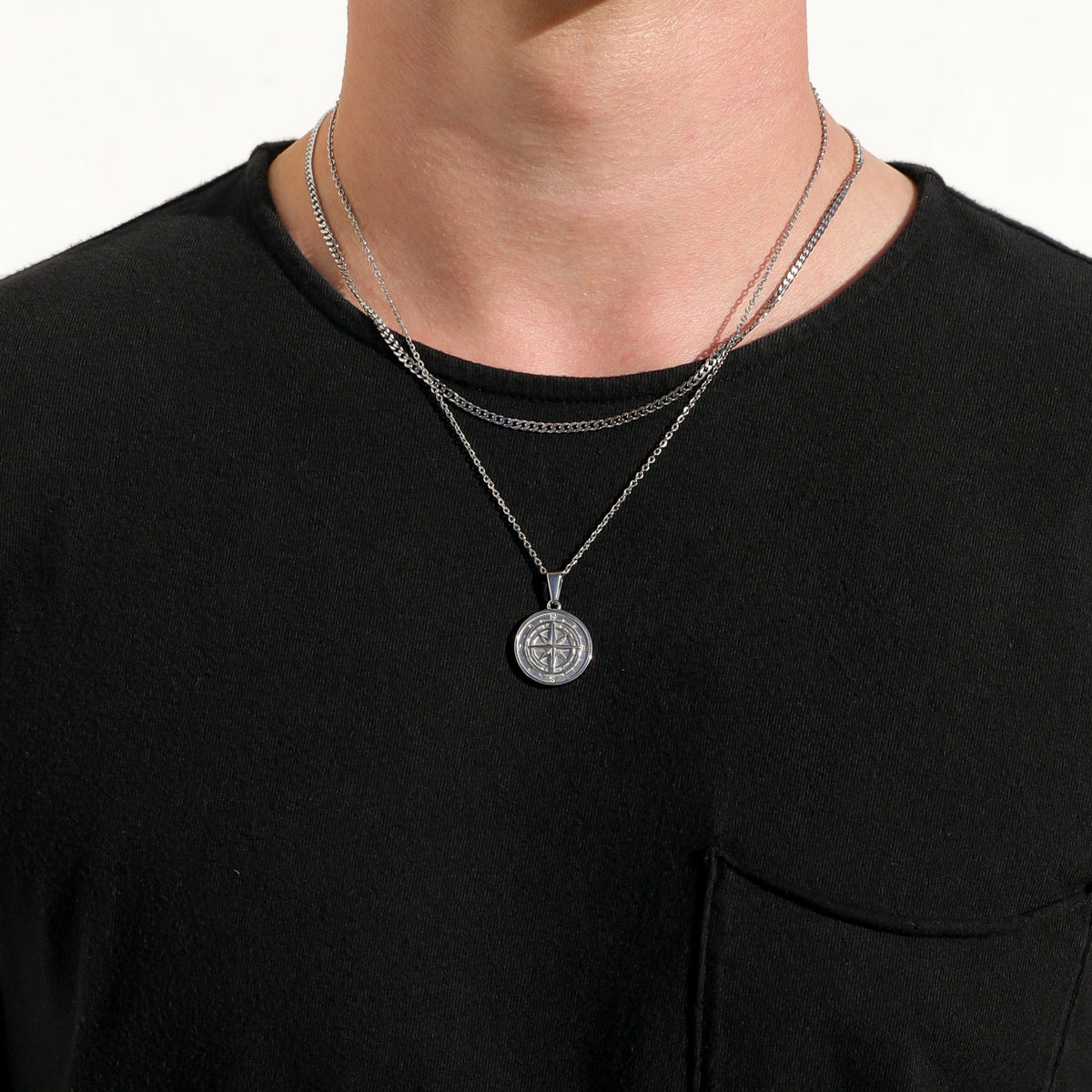 Silver compass pendant necklace set with two round pendants on chain collars