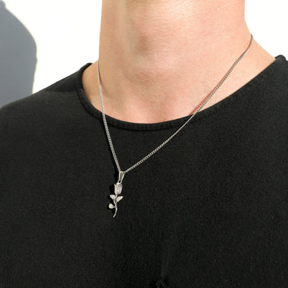 Silver rope chain necklace with rose pendant and leaf charm detail