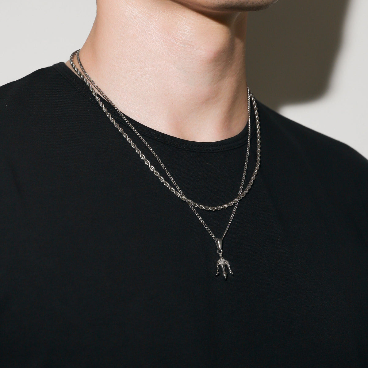 Silver layered chain necklace with trident charm pendant
