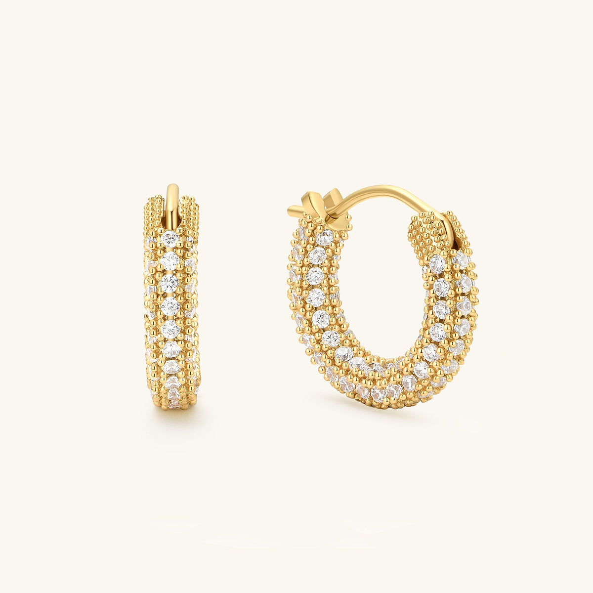 Gold pavé hoop earrings with round crystal accents