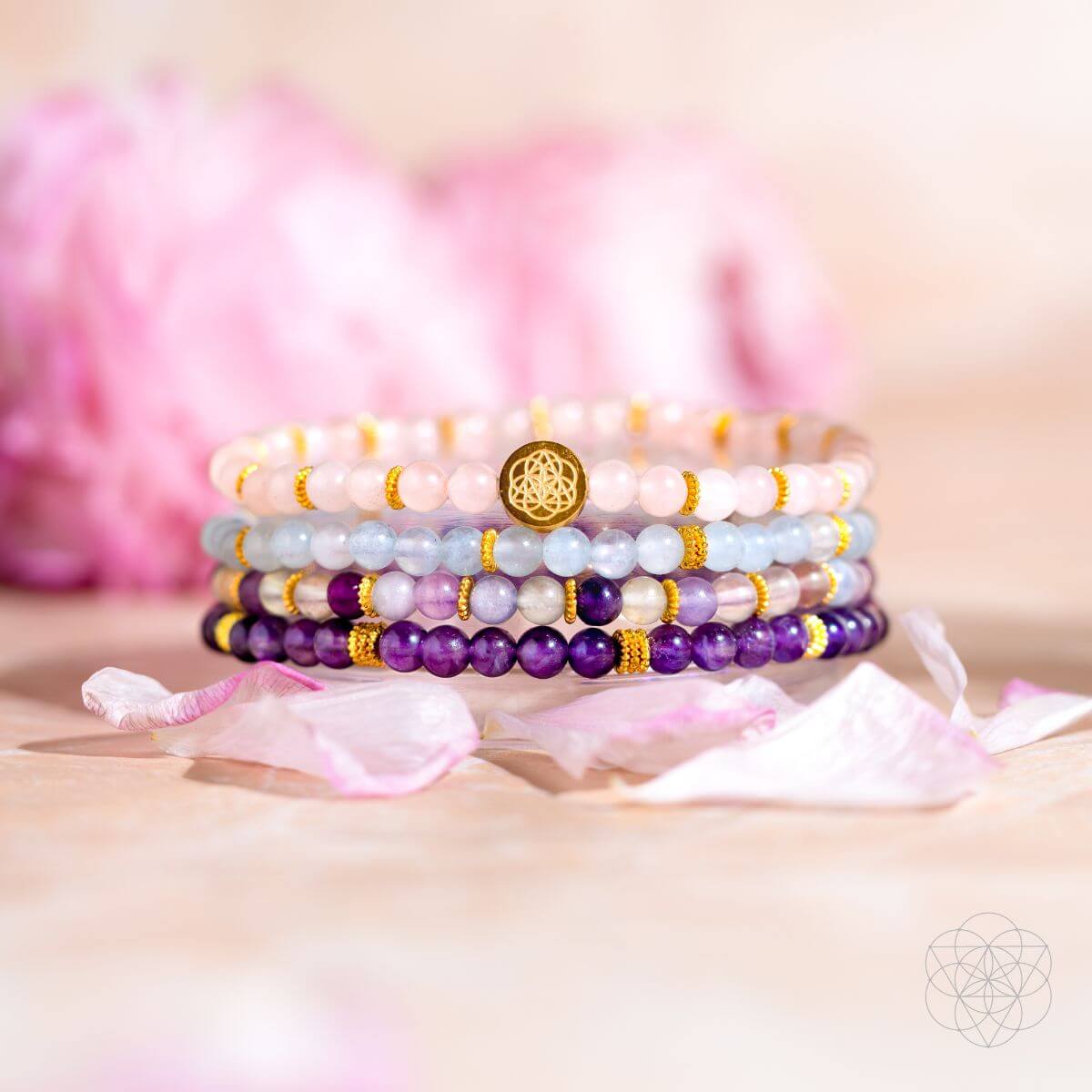 Amethyst, aquamarine, rose quartz, and fluorite beaded bracelet stack with gold accents