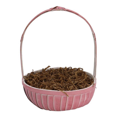 Pink round gift basket with brown shredded filler, no items visible