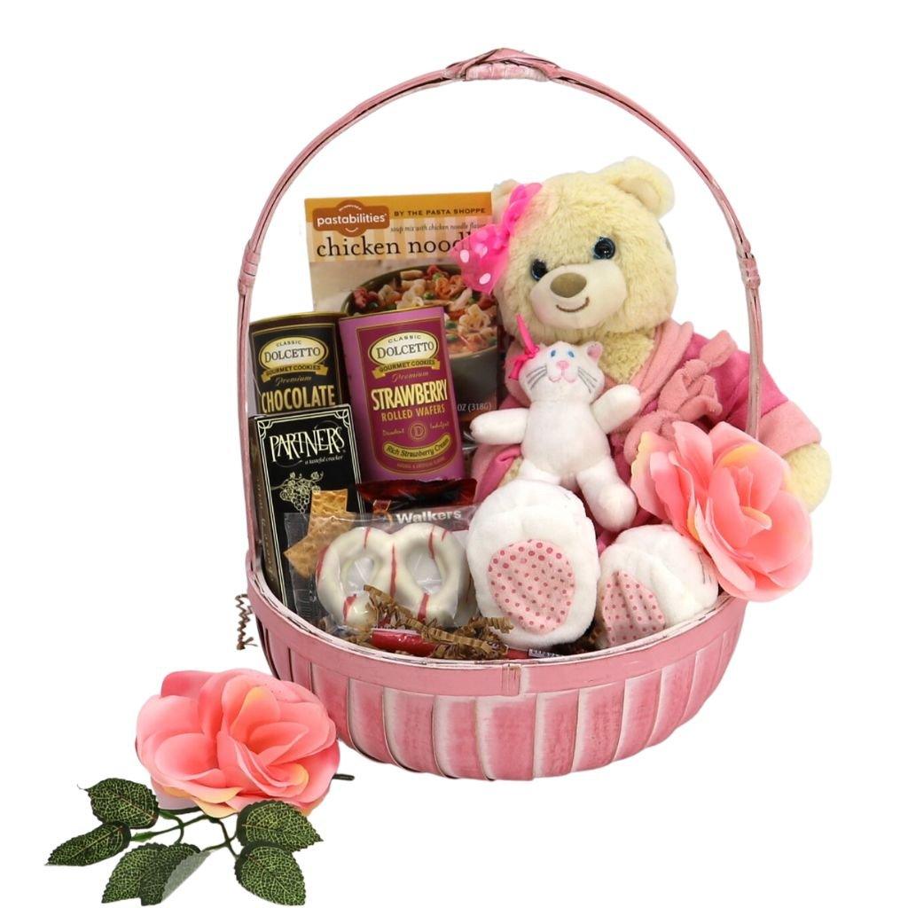 Pink round gift basket with Care Bear plush and small white teddy, rose