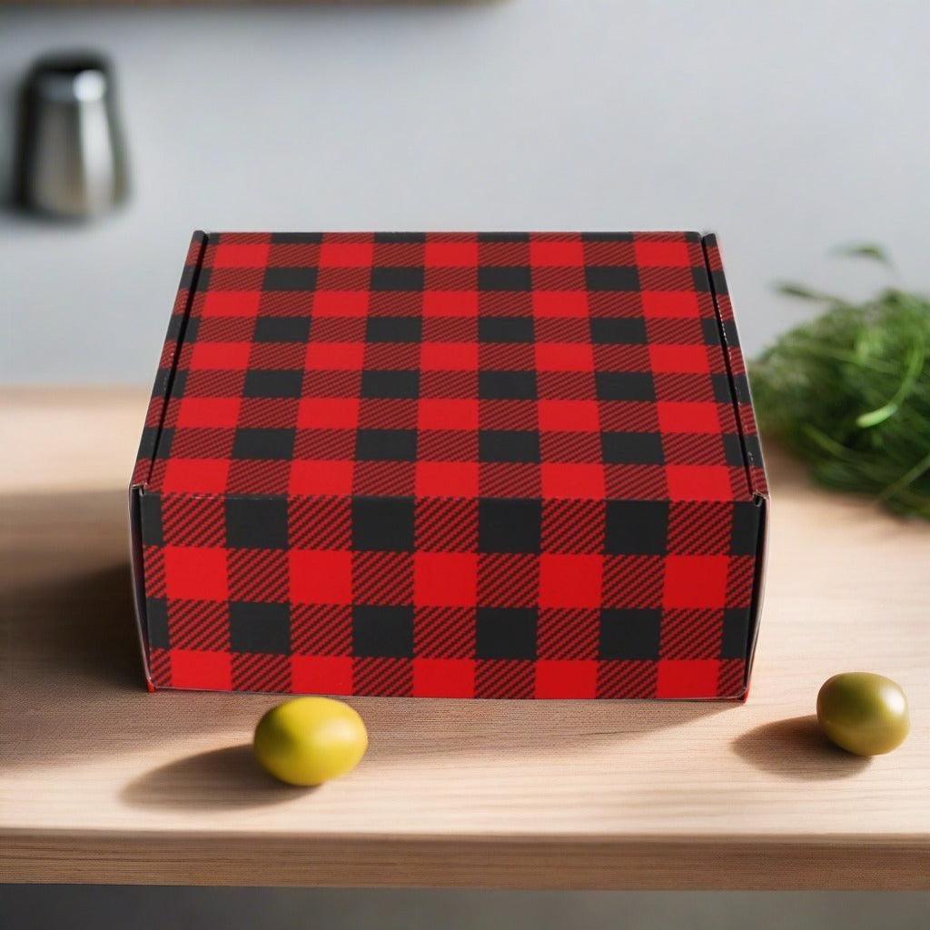 Red-and-black plaid soup gift box, closed lid on tabletop
