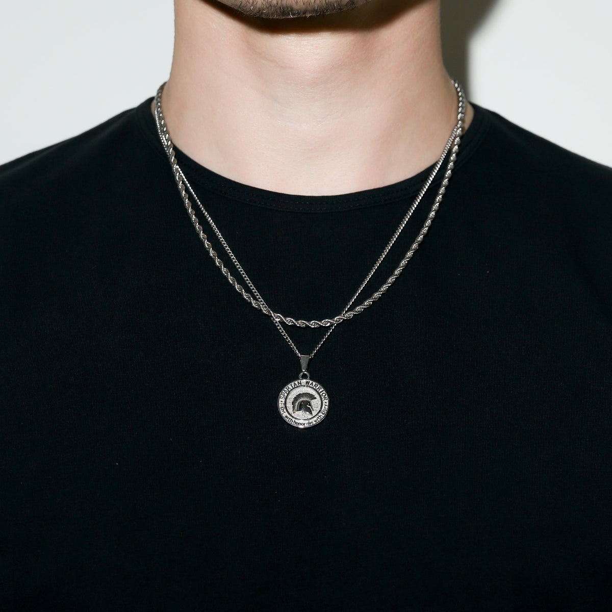 Silver-tone chain necklace with round Spartan warrior emblem pendant
