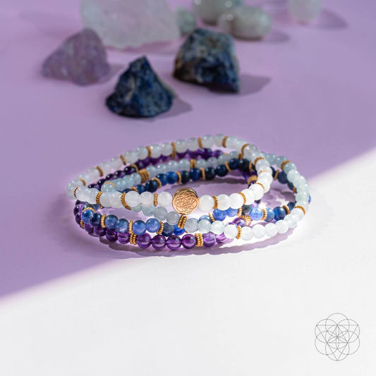 Beaded spiritual healing bracelet set of 4 with purple, blue, and white beads
