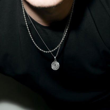 Silver Saint Benedict medal necklace with circular medallion pendant on chain