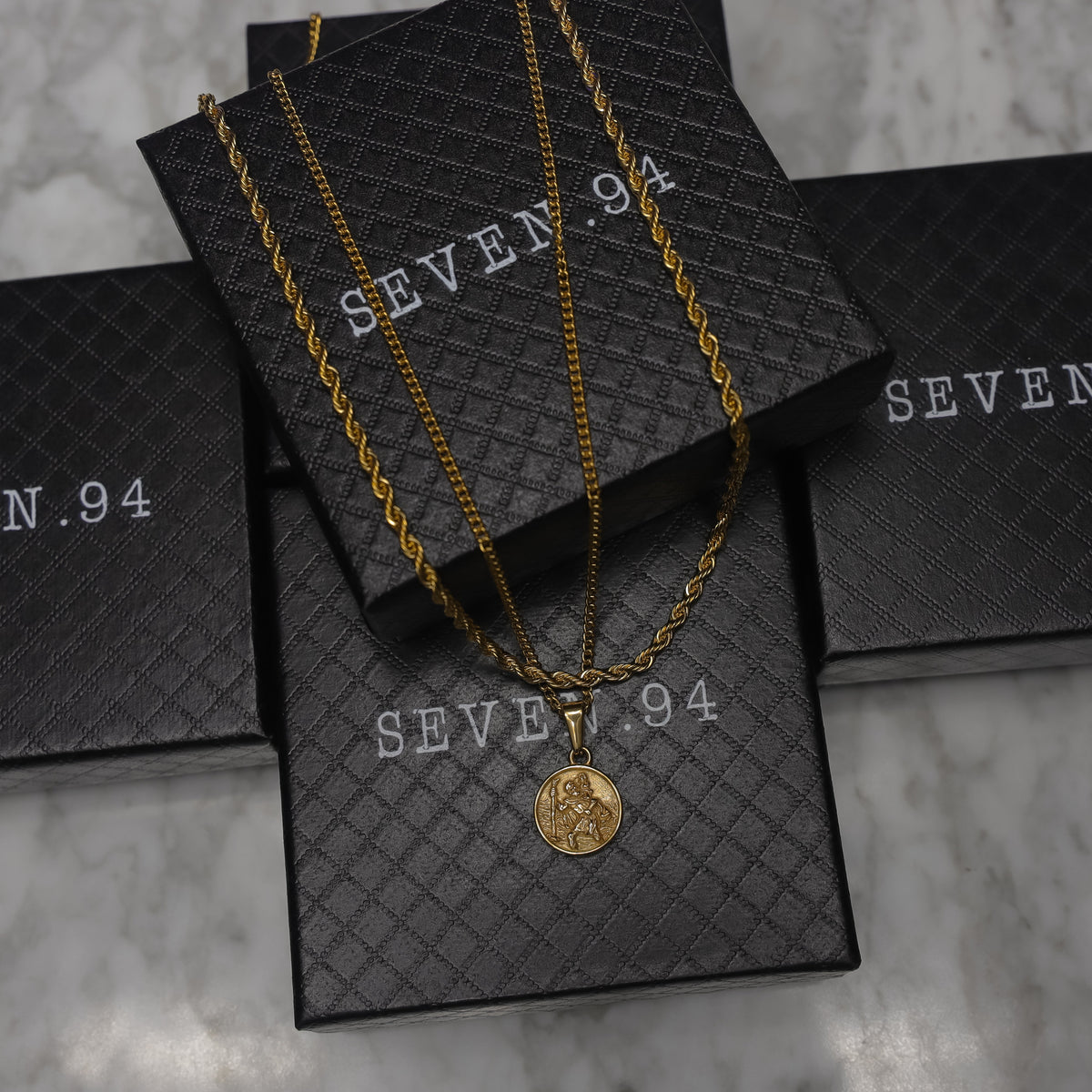 Gold rope necklace set shown in gift box with Saint Christopher medallion pendant