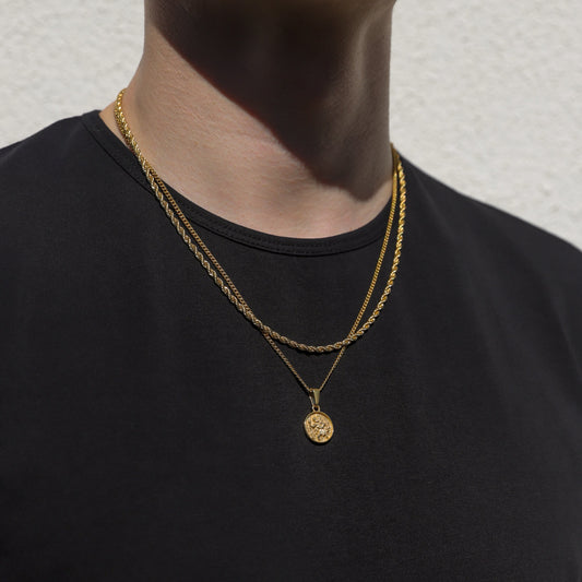 Gold rope necklace set with round Saint Christopher medallion pendant, worn on neck