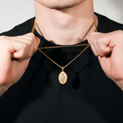 Gold necklace set with two chain layers and oval Saint Mary medallion pendant