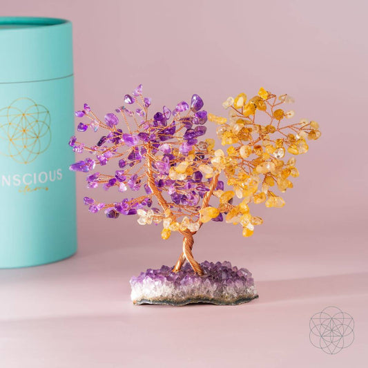 Decorative gemstone fortune tree with purple and gold crystal leaves on amethyst base