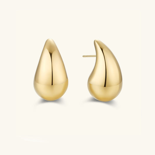 Gold-tone teardrop stud earrings with smooth curved drop shape and post-back closure.