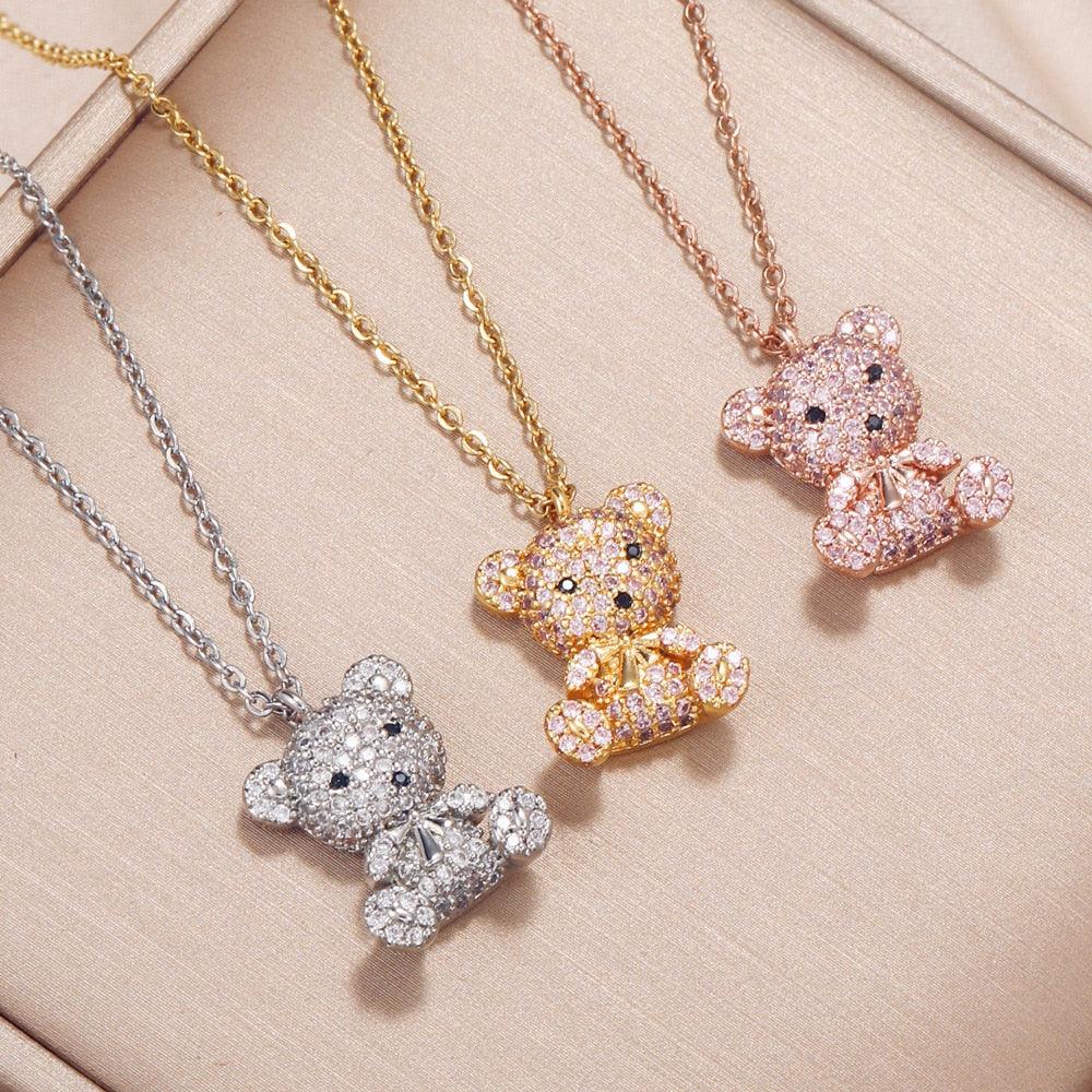 Teddy bear pendant necklace set with teddy pendants in gold, silver, and pink tones