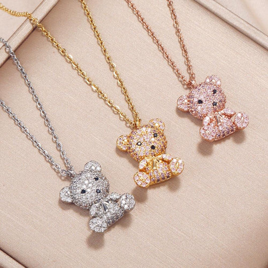 Teddy bear pendant necklace set with teddy pendants in gold, silver, and pink tones