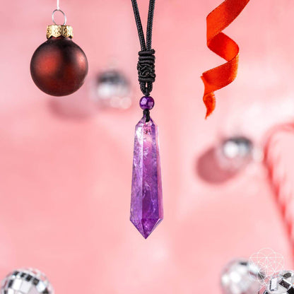 Amethyst point pendant necklace on black cord with purple bead