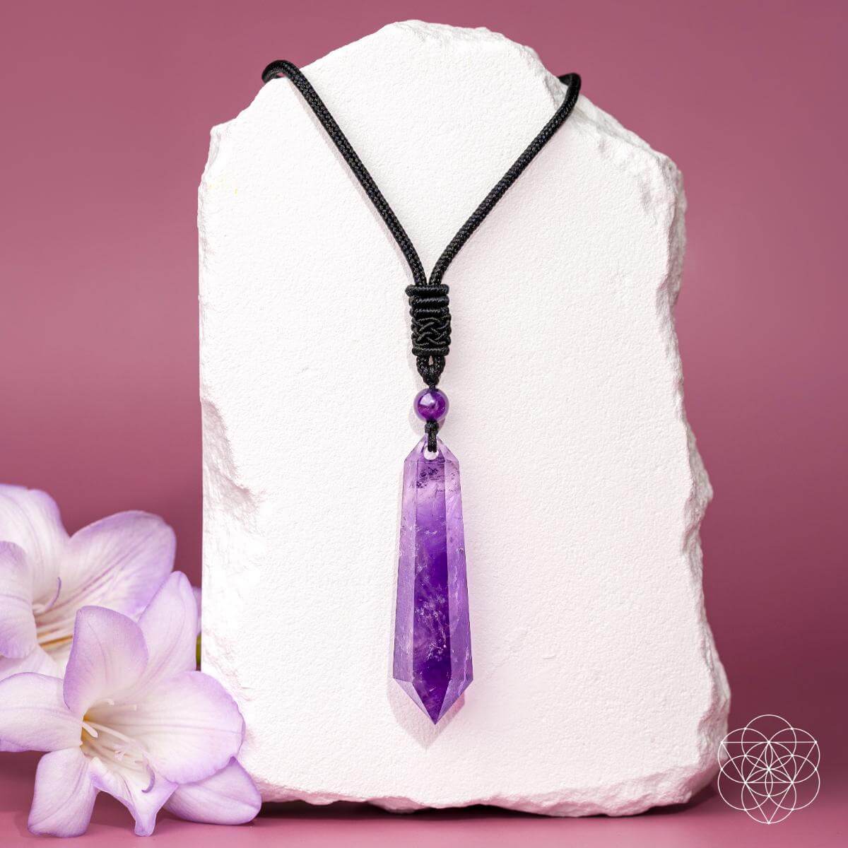Amethyst pendant on black cord necklace with purple crystal bead