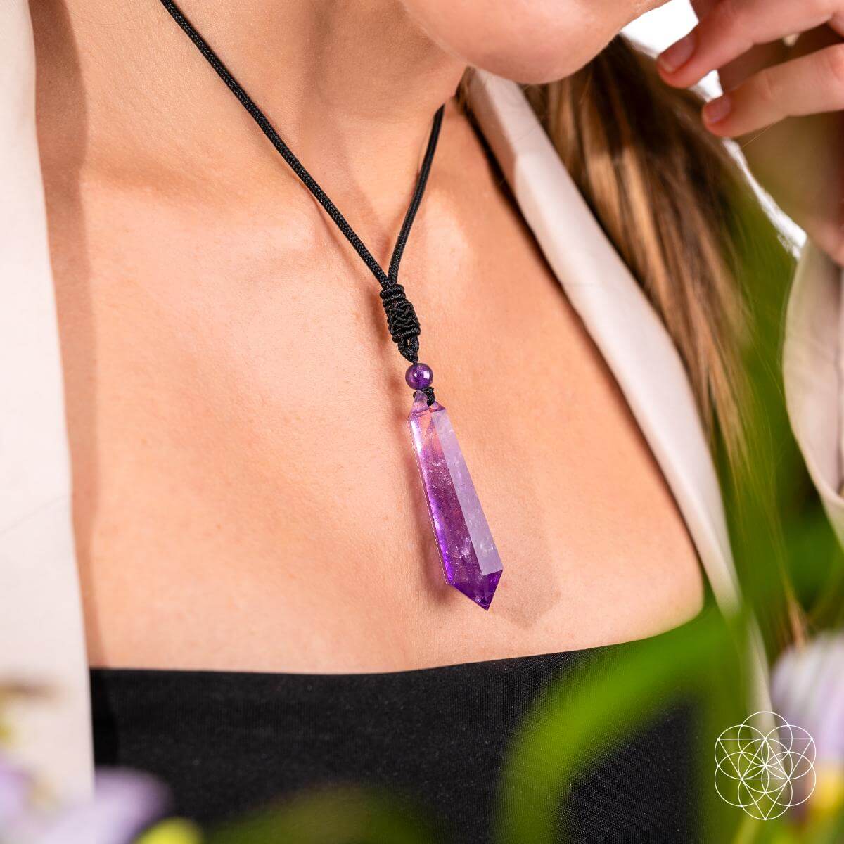 Amethyst point pendant necklace on black braided cord with purple bead