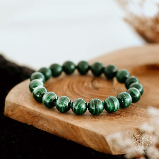 Green malachite bead bracelet with round polished stones, stretchy cord.