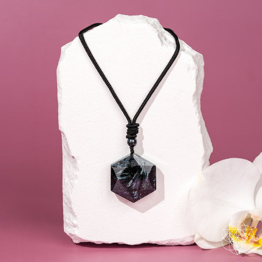 Arfvedsonite healing pendant with dark braided cord and faceted octagon stone