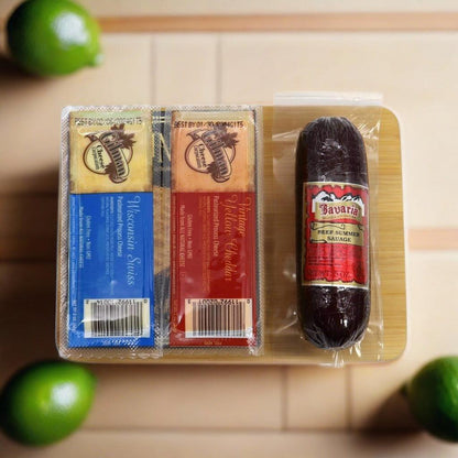 Gourmet board gift set with two packaged spreads and a sausage on a wooden base