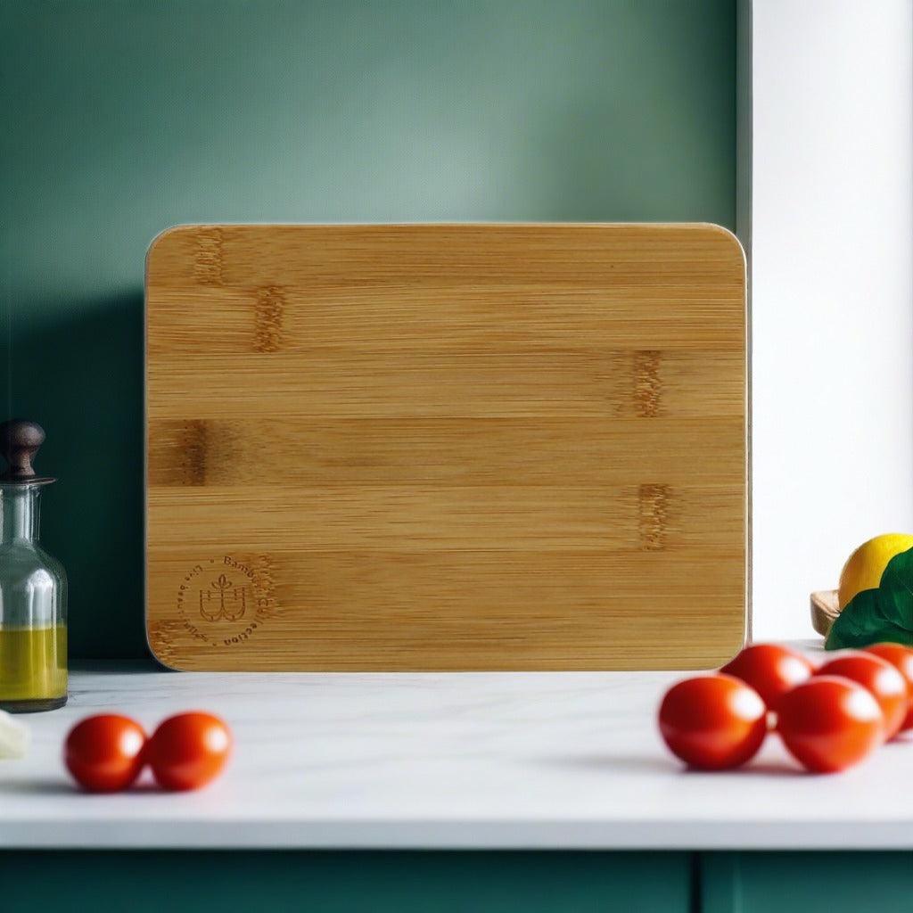 Wooden serving board with engraved logo and handle cutout, shown alone