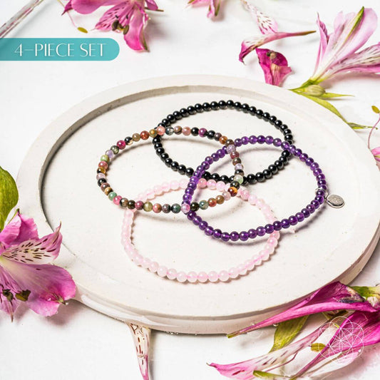 Crystal bracelet set of four beaded bracelets in black, purple, pink, and silver