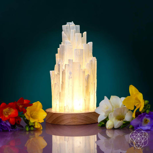 Cleanse-All selenite lamp with glowing white crystal tower on round wooden base