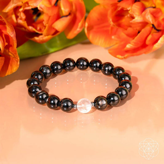 Dark beaded stretch bracelet with clear quartz centerpiece