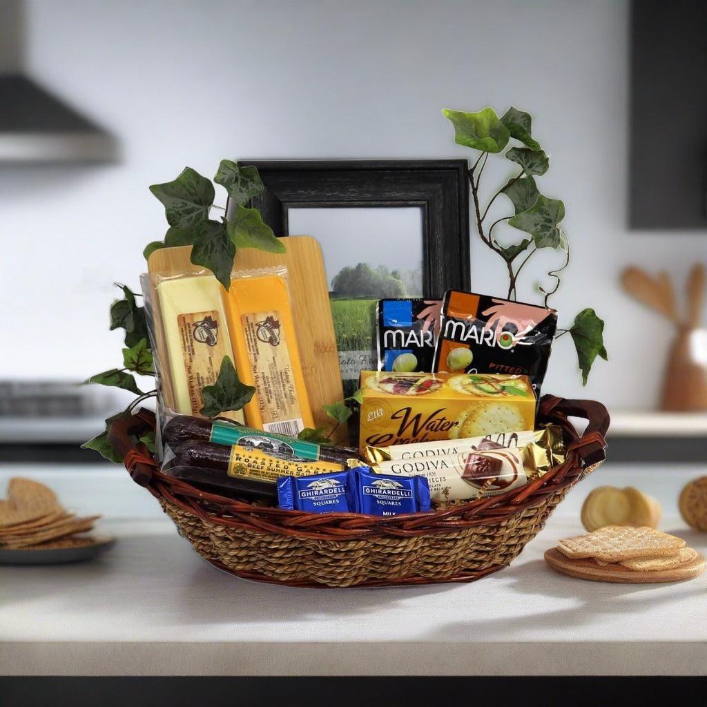 Wicker sympathy gift basket with photo frame and assorted snacks, including crackers and chocolate