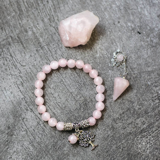 Rose quartz bead bracelet with tree of life charm and rose quartz dowsing pendulum.