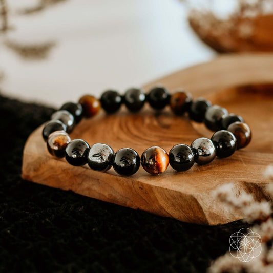 Black, brown, and silver beaded bracelet with round stones and stretch fit
