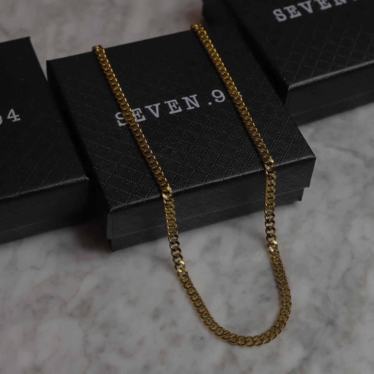 Gold Miami Cuban link chain necklace, 4.5 mm, 18K gold PVD, coiled on boxes