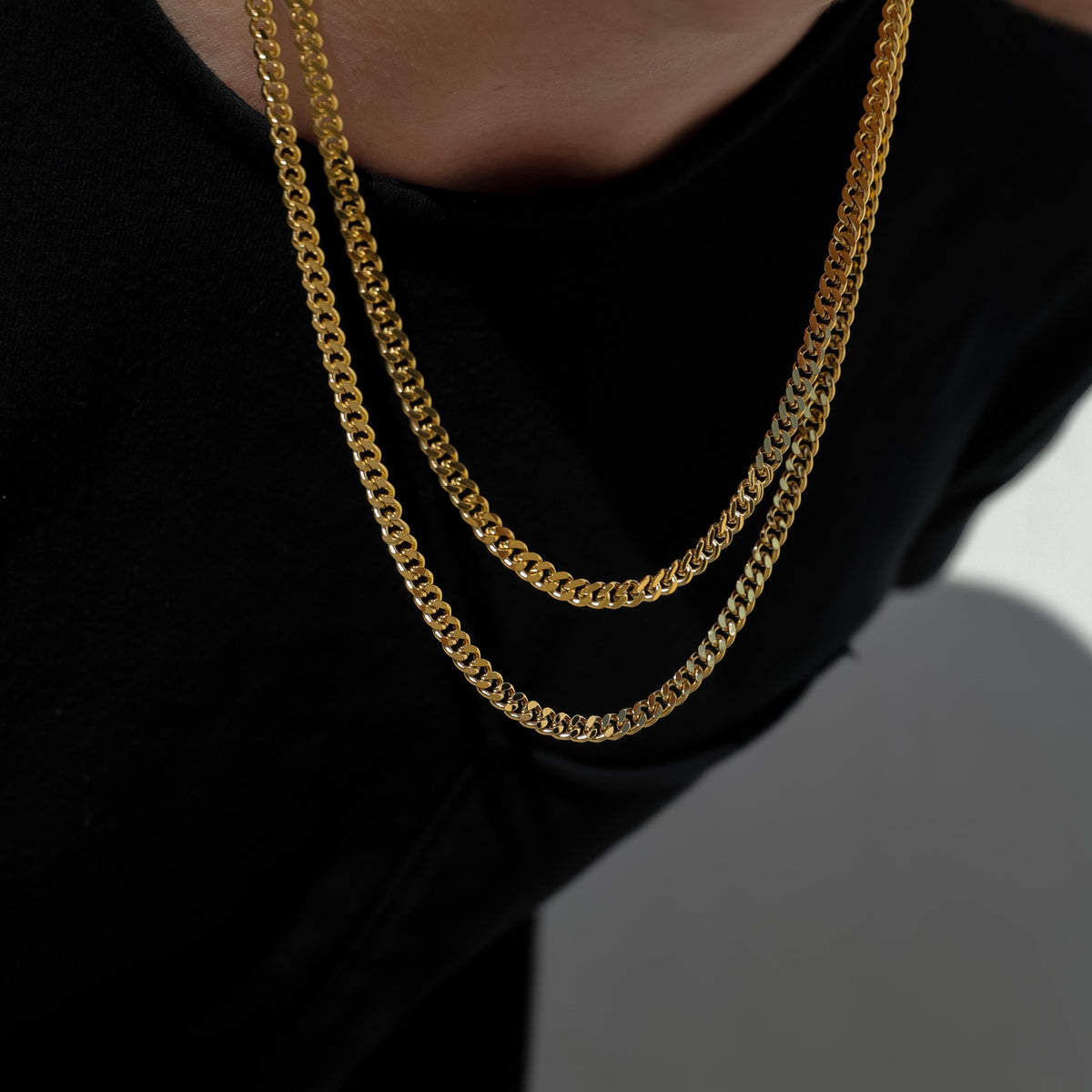 Gold Miami Cuban link chain necklace, 4.5 mm, 18K gold PVD, double stacked on neck