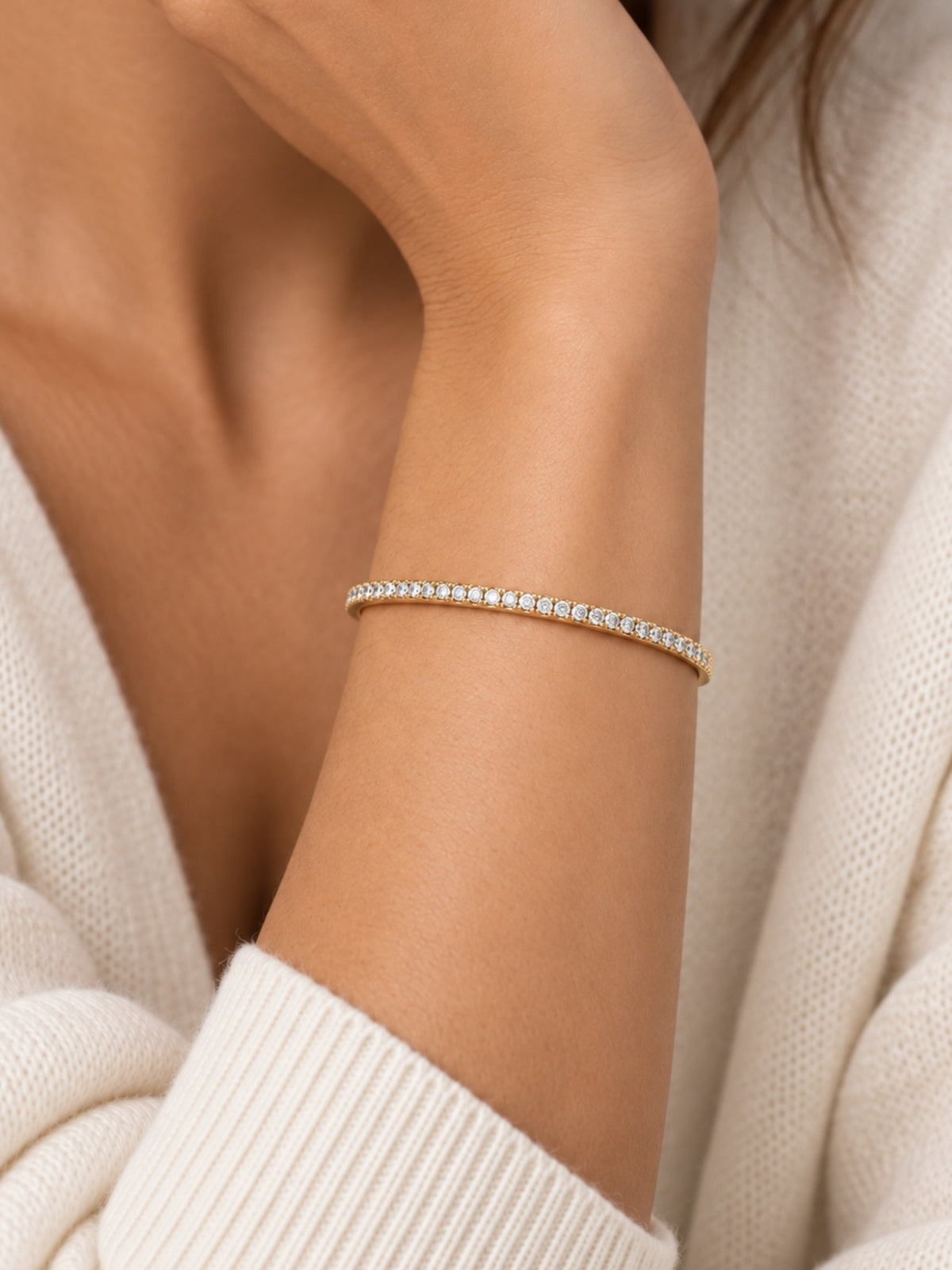 Thin gold-filled pave cuff bracelet on a wrist