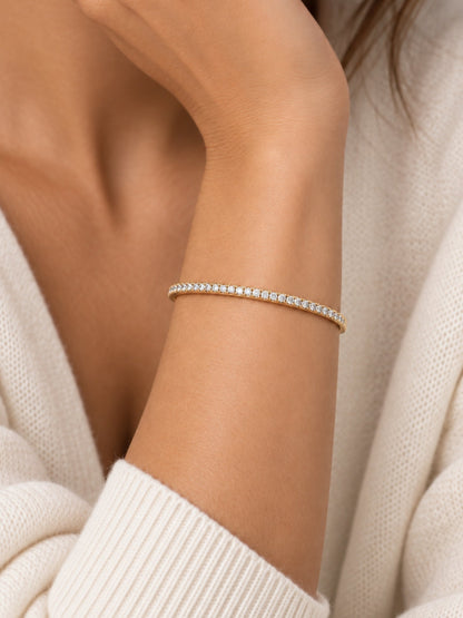 Thin gold-filled pave cuff bracelet on a wrist