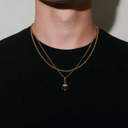Gold double-chain necklace with trident pendant at center