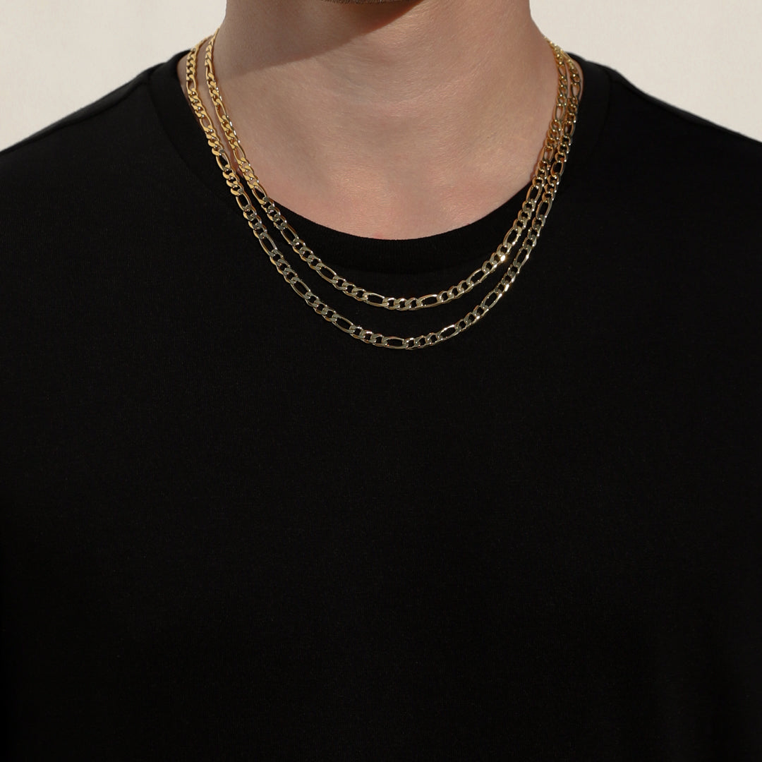 Layered gold-tone Figaro chain necklaces, oval link pattern